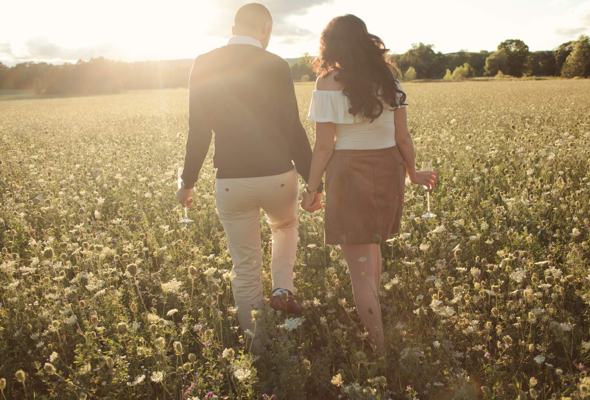 wildflower field at sunset engagement