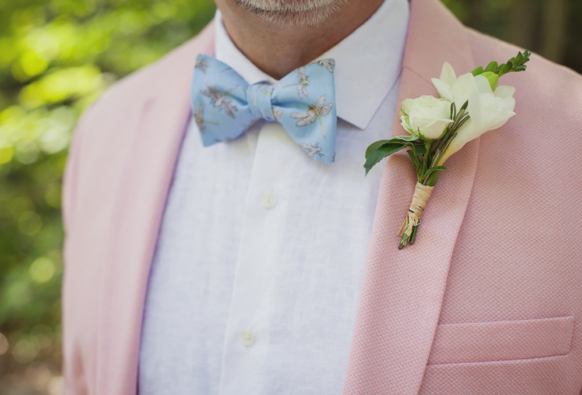 groom in pink suit