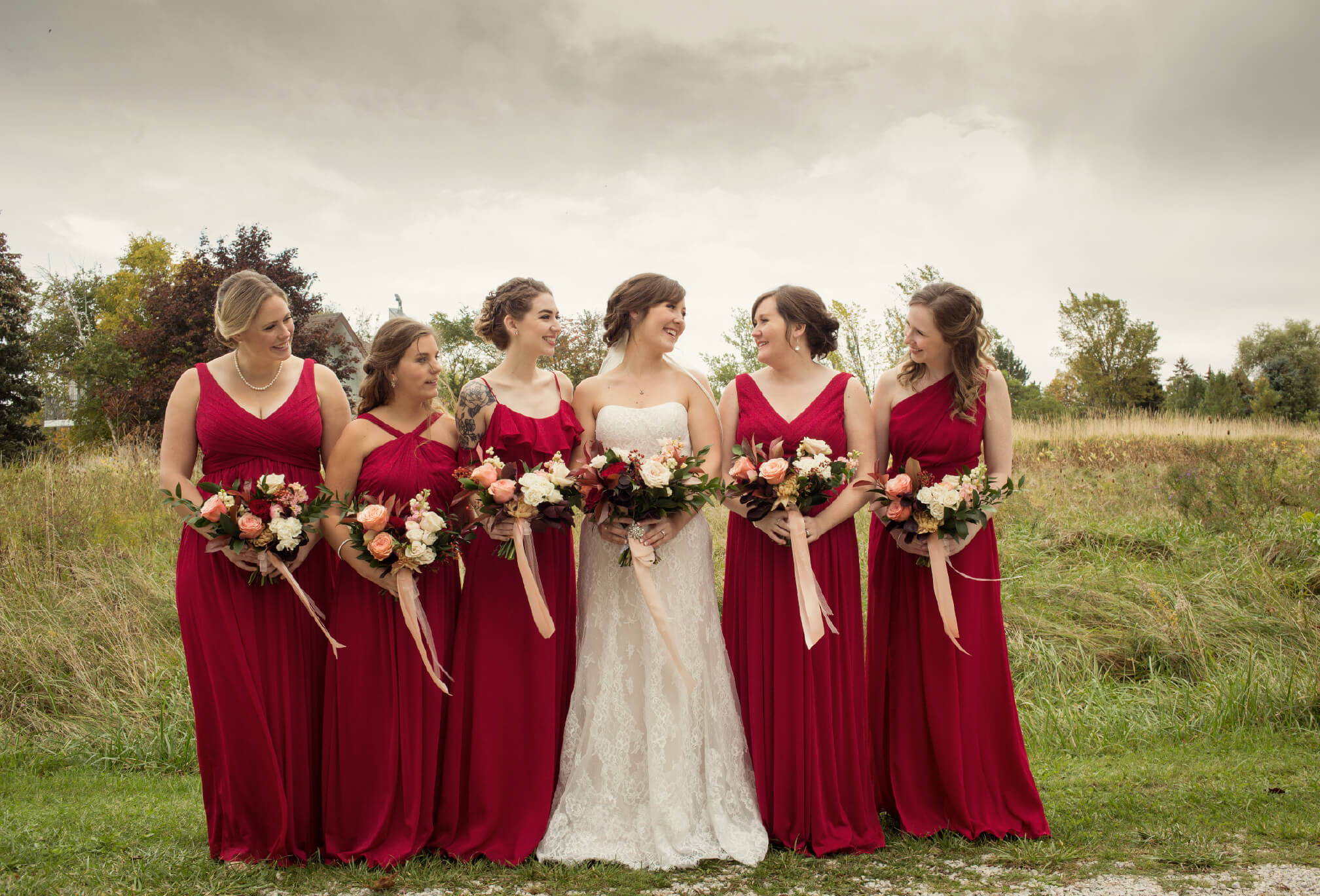 red bridesmaids in fall rustic