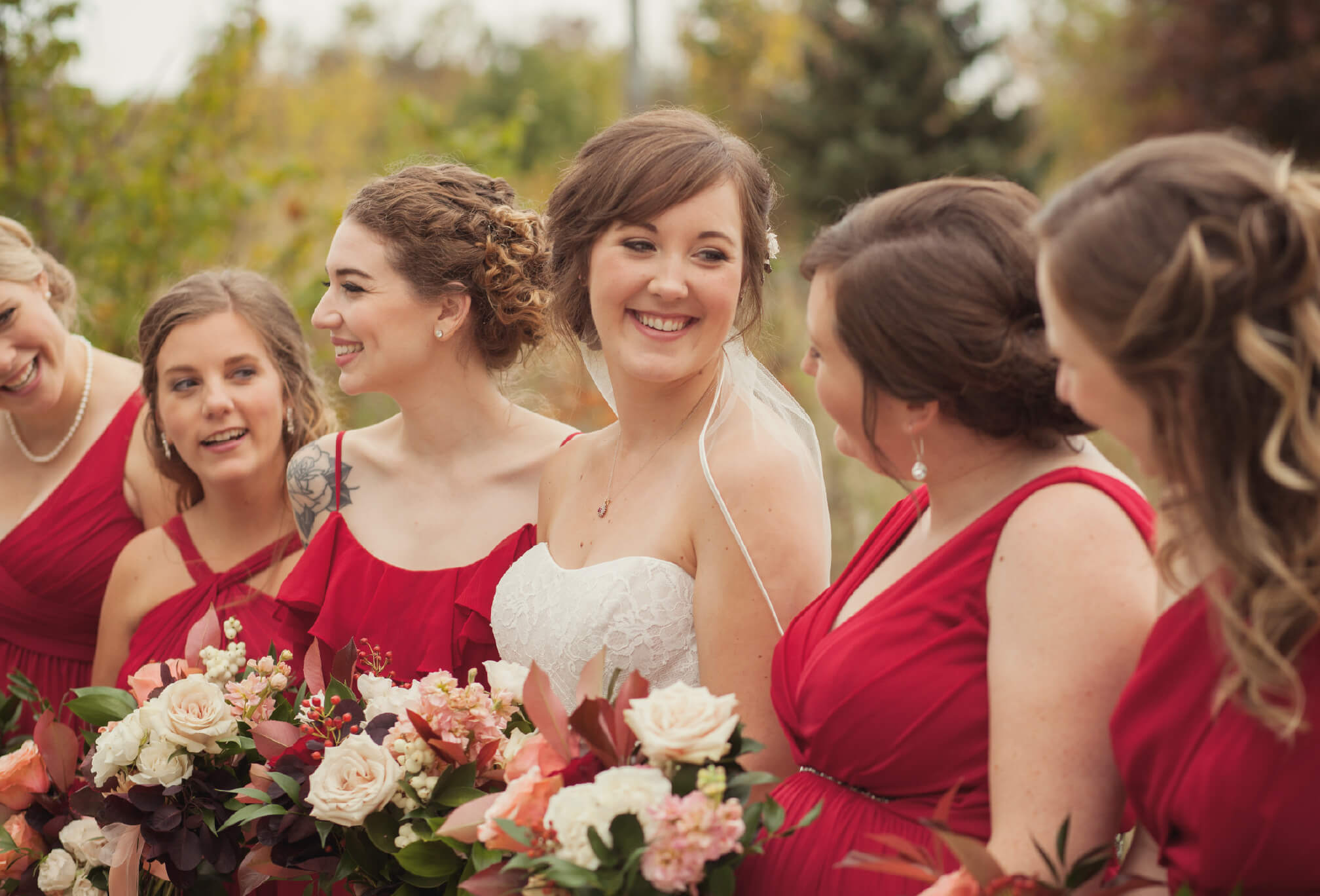 red bridesmaids in fall rustic