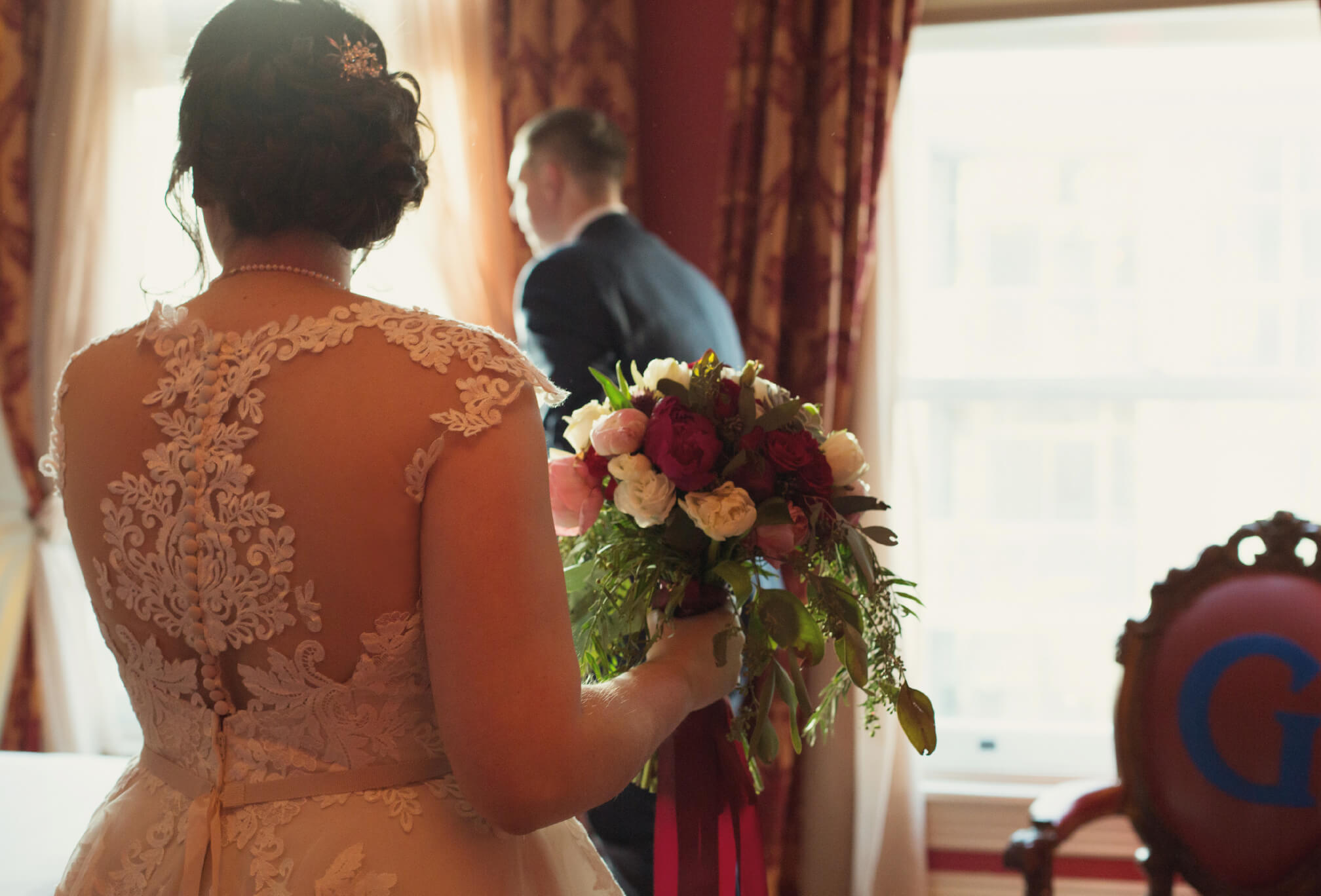 bride and groom in gladstone hotel room romantic