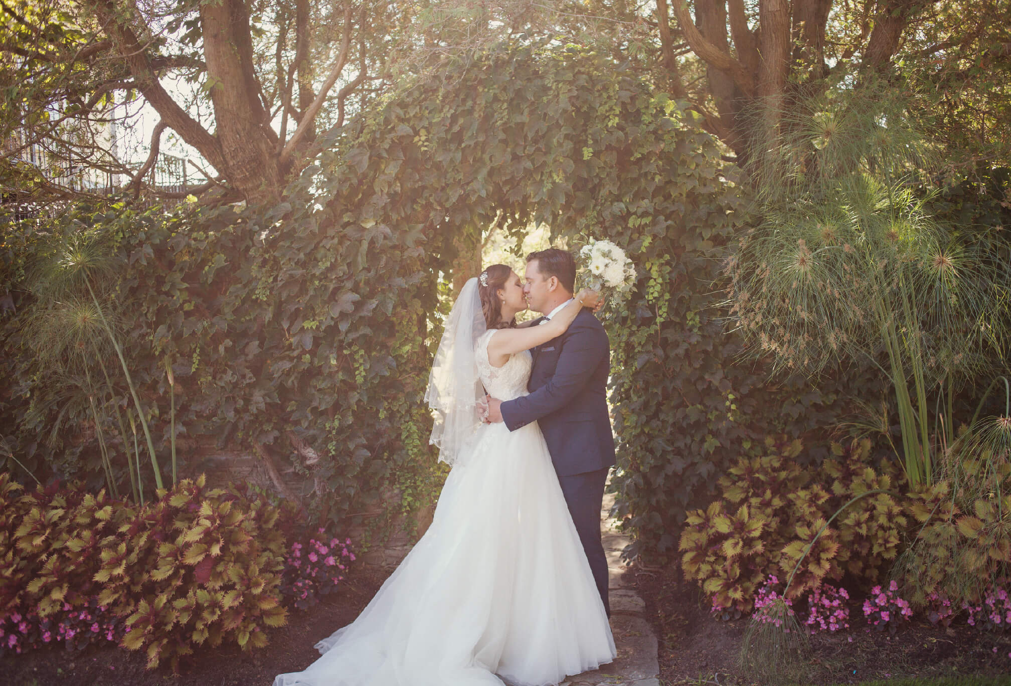 bride and groom kissing gairloch gardens