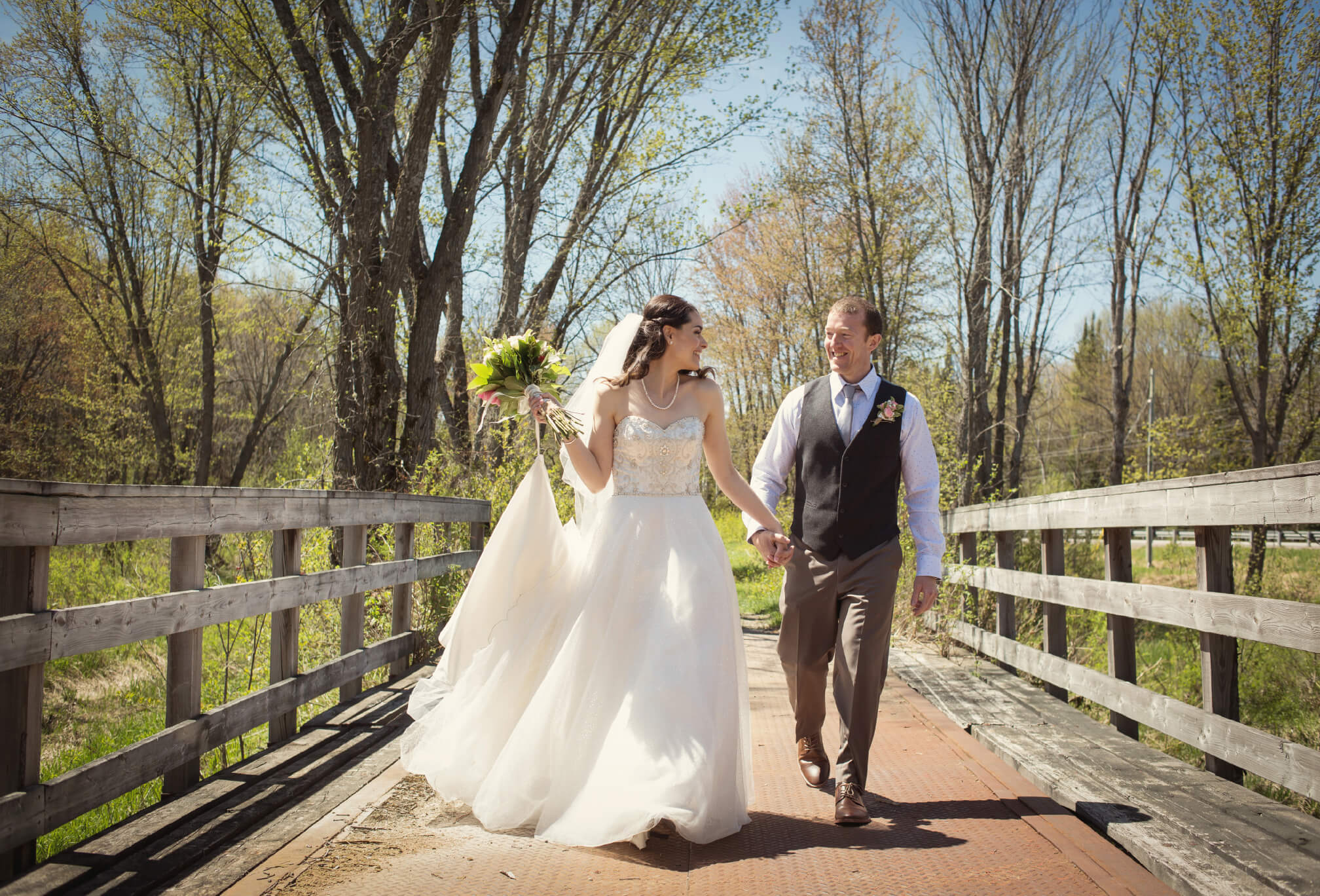 bride and groom on bridge powassan 