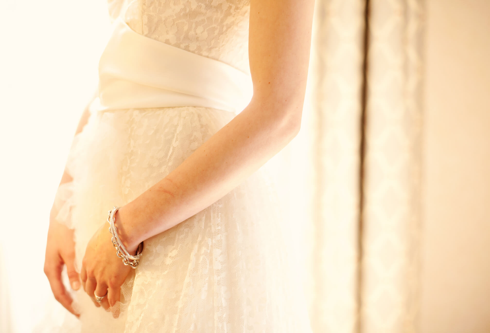 vintage lace wedding dress detail with bracelet